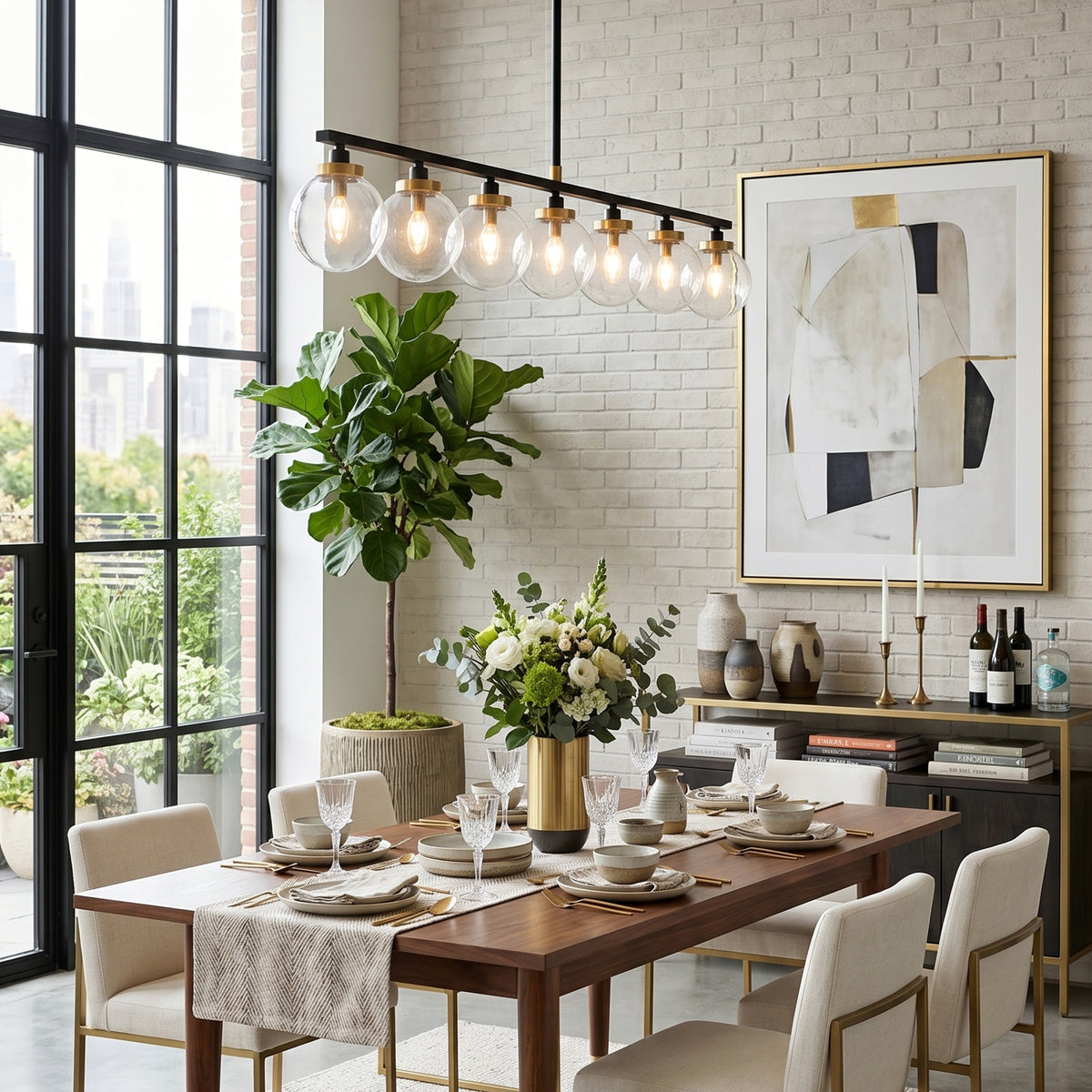 Alistair Linear Glass Globe Chandelier | Dining Room Chandelier | Providing warm overhead illumination above a long wooden dining table paired with chic white upholstered chairs | Severn Lighting