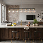 Alistair Linear Glass Globe Chandelier | Contemporary Bar Light | Installed as overhead accent lighting above a dark wood kitchen breakfast bar with modern black counter stools | Severn Lighting