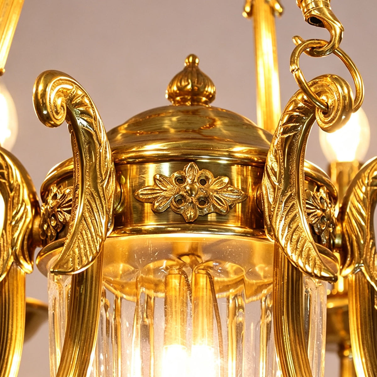 Anders Fluted Glass Urn Brass Chandelier | Fluted Glass and Brass | Macro detail showing the ornate carved brass cap atop the fluted glass urn | Severn Lighting