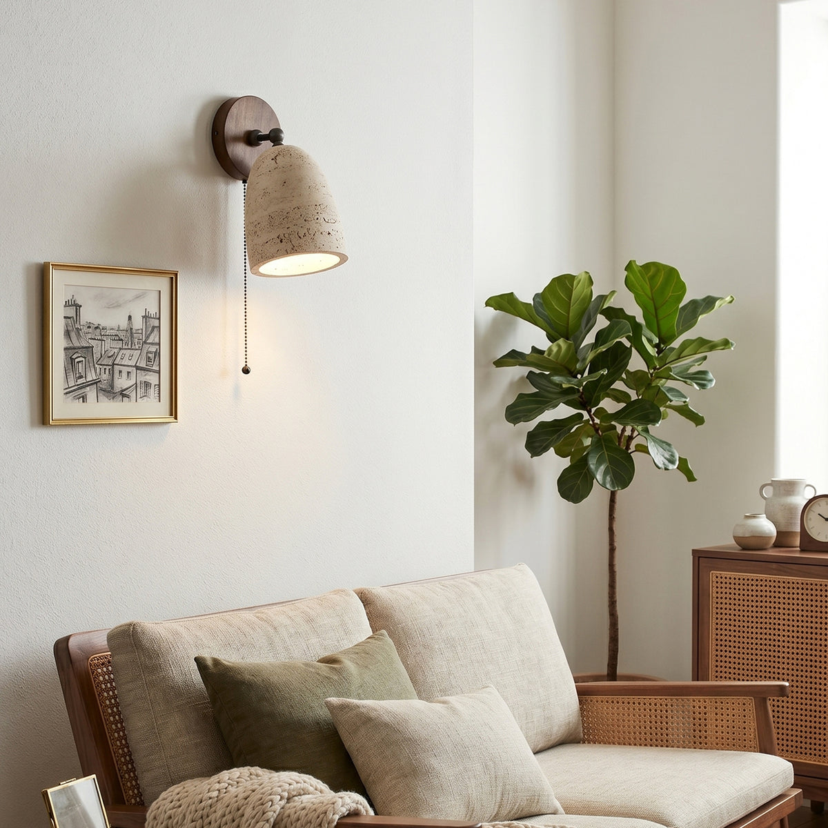 Aria Travertine Wood Wall Lamp | Travertine, Wood, Metal | Providing warm ambient light above a cream fabric sofa next to a fiddle-leaf fig tree in a modern living room | Samu Lamp
