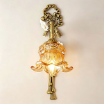 Armelle Rose Glass Brass Wall Lamp | Glass, Ceramic and Brass | Full view glowing brightly on a plain neutral background | Severn Lighting