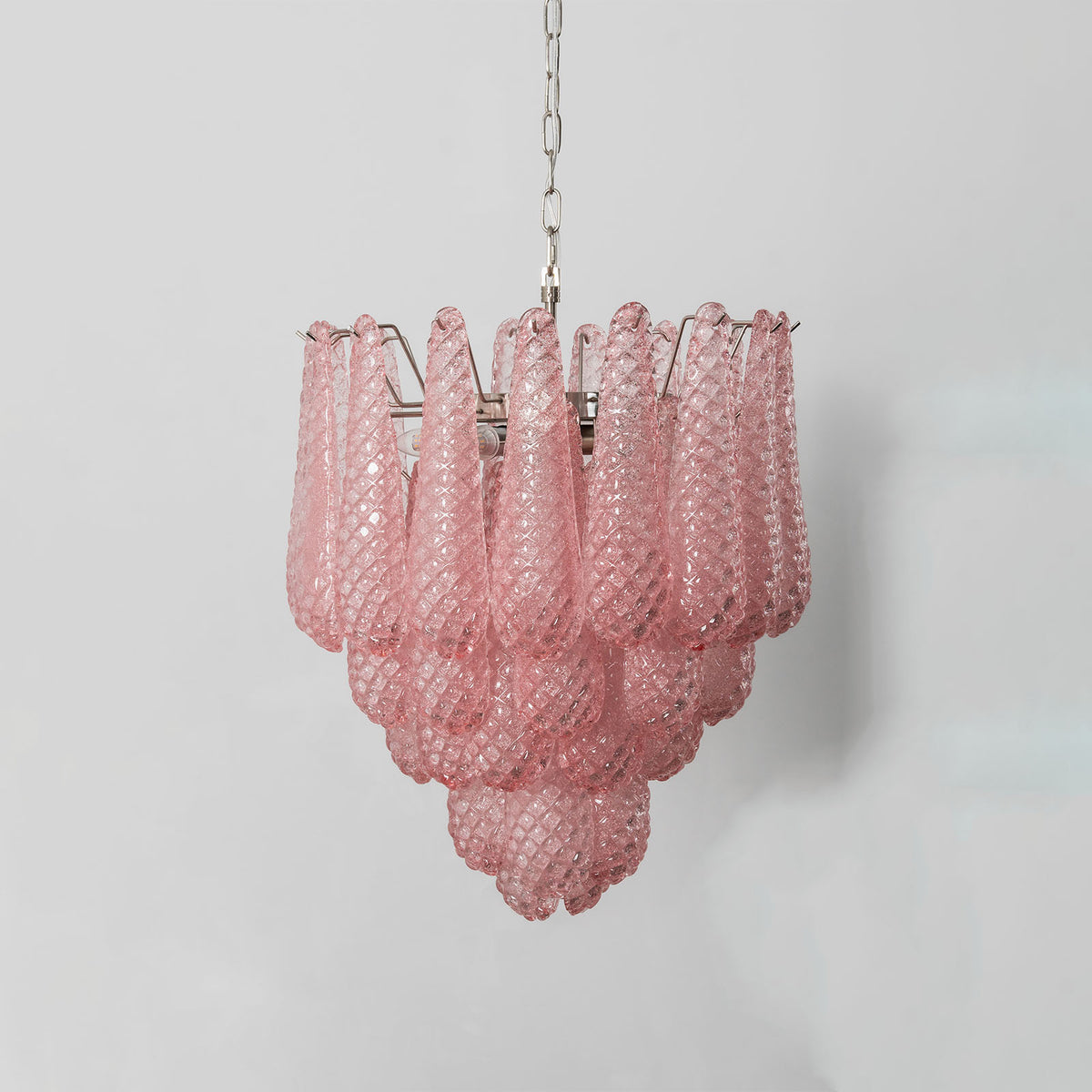 Aubine Pink Textured Glass Tiered Chandelier | Pink Textured Glass and Brass | Studio product shot illuminated gracefully against a plain grey backdrop | Severn Lighting