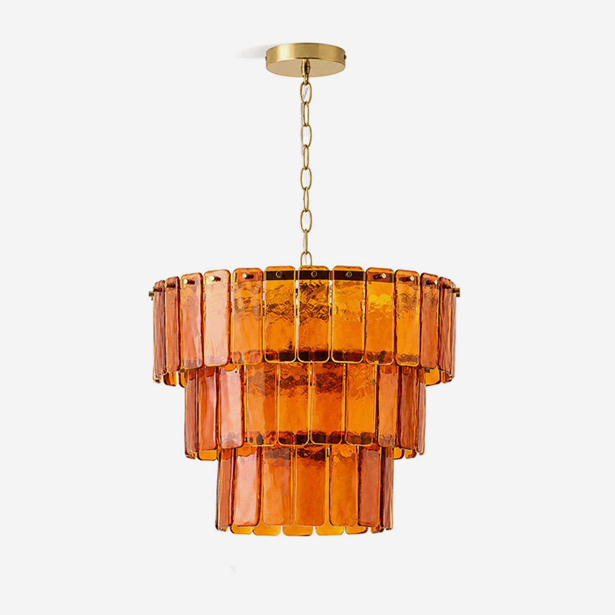 Aurelia Tiered Amber Glass Chandelier | Glass, Metal | Fully lit luxury modern tiered chandelier featuring three concentric layers of rectangular amber orange glass panels suspended by a gold chain from a brass canopy | Isolated product shot on white background | Severn Lighting