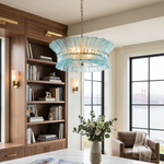 Azura Aquamarine Cascading Glass Chandelier | Glass, Metal | Positioned as a luxury accent light fixture in a sophisticated home executive workspace featuring a large wooden desk and built-in library shelves | Severn Lighting