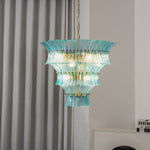 Azura Aquamarine Cascading Glass Chandelier | Glass, Metal | Studio variant view of a shallower wide-rimmed tier version of the blue glass chandelier illuminated against a plain background | Severn Lighting