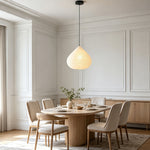 Bryony Teardrop Paper Pendant Light | Washi Paper and Metal | Displayed over a round dining table in a minimalist dining room | Severn Lighting