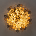 Cassian Tiered Fluted Glass Ceiling Light | Tiered Fluted Glass and Gold Brass | Directly underneath view fully illuminated showcasing the glowing radial multi-colored glass layers | Severn Lighting