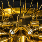 Cassian Tiered Fluted Glass Ceiling Light | Tiered Fluted Glass and Gold Brass | Detailed macro shot looking into the internal gold brass framework and multi-bulb socket hardware | Severn Lighting