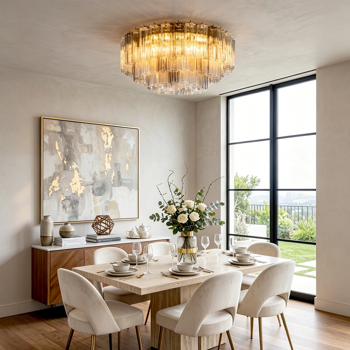Cassian Tiered Fluted Glass Ceiling Light | Tiered Fluted Glass and Gold Brass | Hanging over an elegant white dining table and chairs near a large landscape window and artwork | Severn Lighting