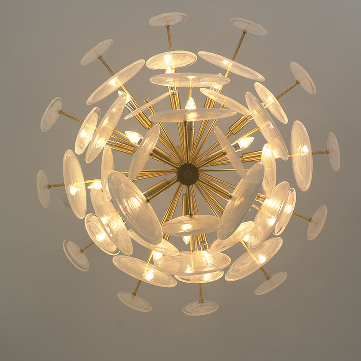 Celestia Art Glass Disc Chandelier | Glass, Metal | Direct bottom-up perspective looking into the glowing radial cluster of art glass discs and gold brass frame spokes | Detail shot | Severn Lighting