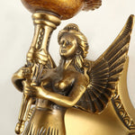 Clemency Winged Figure Brass Sconce | Cast Brass and Glass | Close-up highlighting the sculpted winged figure holding the torch stem | Severn Lighting