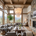Ethereal Icicle Waterfall Chandelier | Frosted Icicle Glass and Gold Brass | Styled in a spacious timber mountain lodge living area with large scenic mountain view windows | Severn Lighting