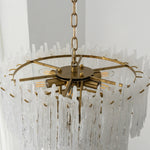Ethereal Icicle Waterfall Chandelier | Frosted Icicle Glass and Gold Brass | Top-angle unlit product view showing the circular tiered gold frame and hanging glass rods | Severn Lighting