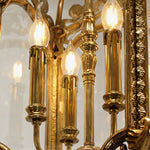 Florian Fretwork Brass Lantern Pendant Light | Glass and Brass | Detail shot highlighting the illuminated candle bulbs inside the lantern | Severn Lighting