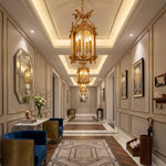 Florian Fretwork Brass Lantern Pendant Light | Glass and Brass | Illuminating a grand hallway corridor with a patterned runner rug | Severn Lighting