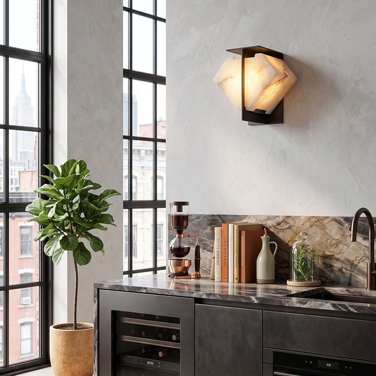 Freya Angular Alabaster Wall Sconce | Industrial Kitchen Bar | Mounted on a concrete texture wall next to a modern dark kitchen island counter, wine cooler, and grid window | Severn Lighting