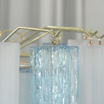 Givrane Two-Tone Glass Tube Tiered Chandelier | Two-Tone Glass and Brass | Close-up view of the top brass frame and glass tube hanging hardware | Severn Lighting