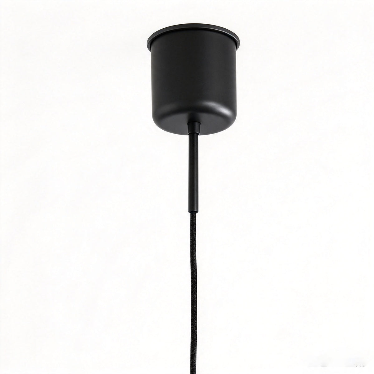 Holmvik Walnut Ring Tiered Metal Pendant Light | Walnut Wood and Metal | Close-up detail shot of the minimalist black metal ceiling canopy and cord | Severn Lighting