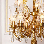 Isambard Candelabra Table Lamp | Cut Crystal and Brass | Medium close-up showing illuminated candle tiers and glass shades | Severn Lighting