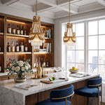 Isambard Crowned Crystal Basket Pendant Light | Cut Crystal and Brass | Pair of lights over a marble kitchen island with blue bar stools | Severn Lighting