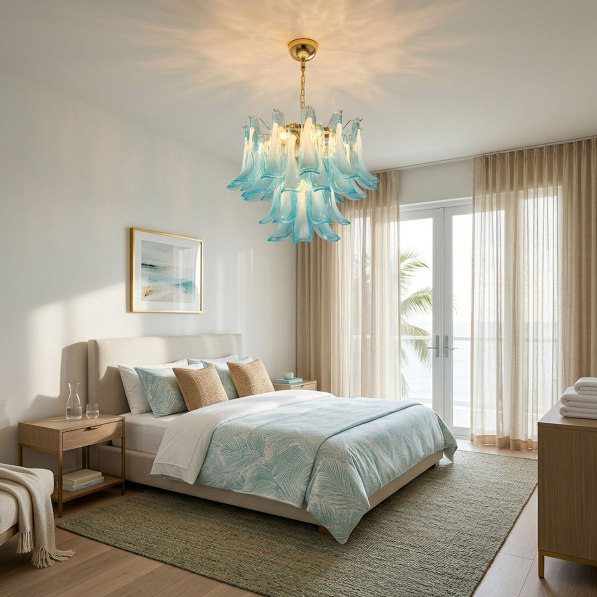 Isar Blue Petal Glass Chandelier | Blue Glass and Brass | Hanging in a cozy bedroom near a bed with oceanfront balcony view | Severn Lighting