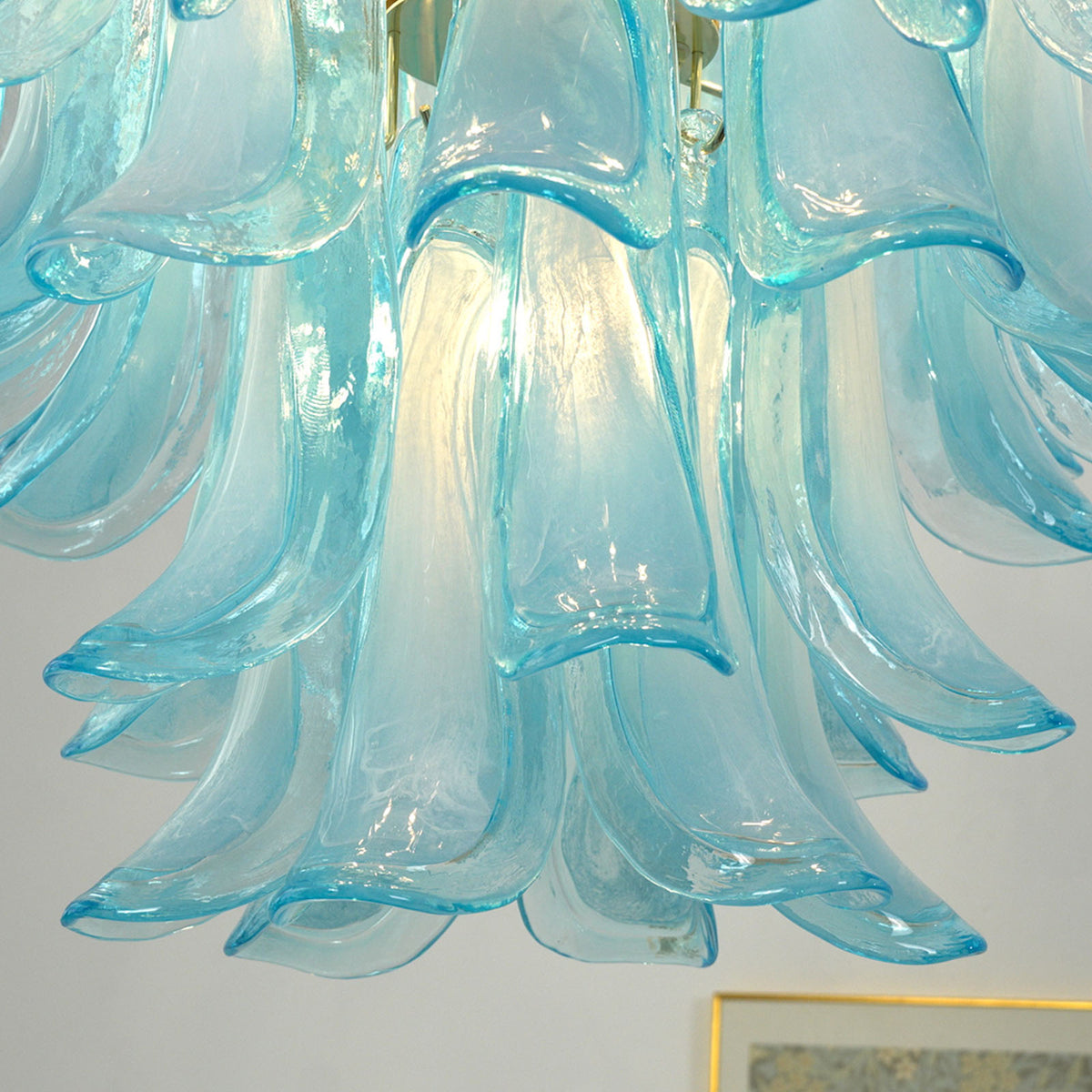 Isar Blue Petal Glass Chandelier | Blue Glass and Brass | Close-up view highlighting the glowing blue glass petal shades | Severn Lighting