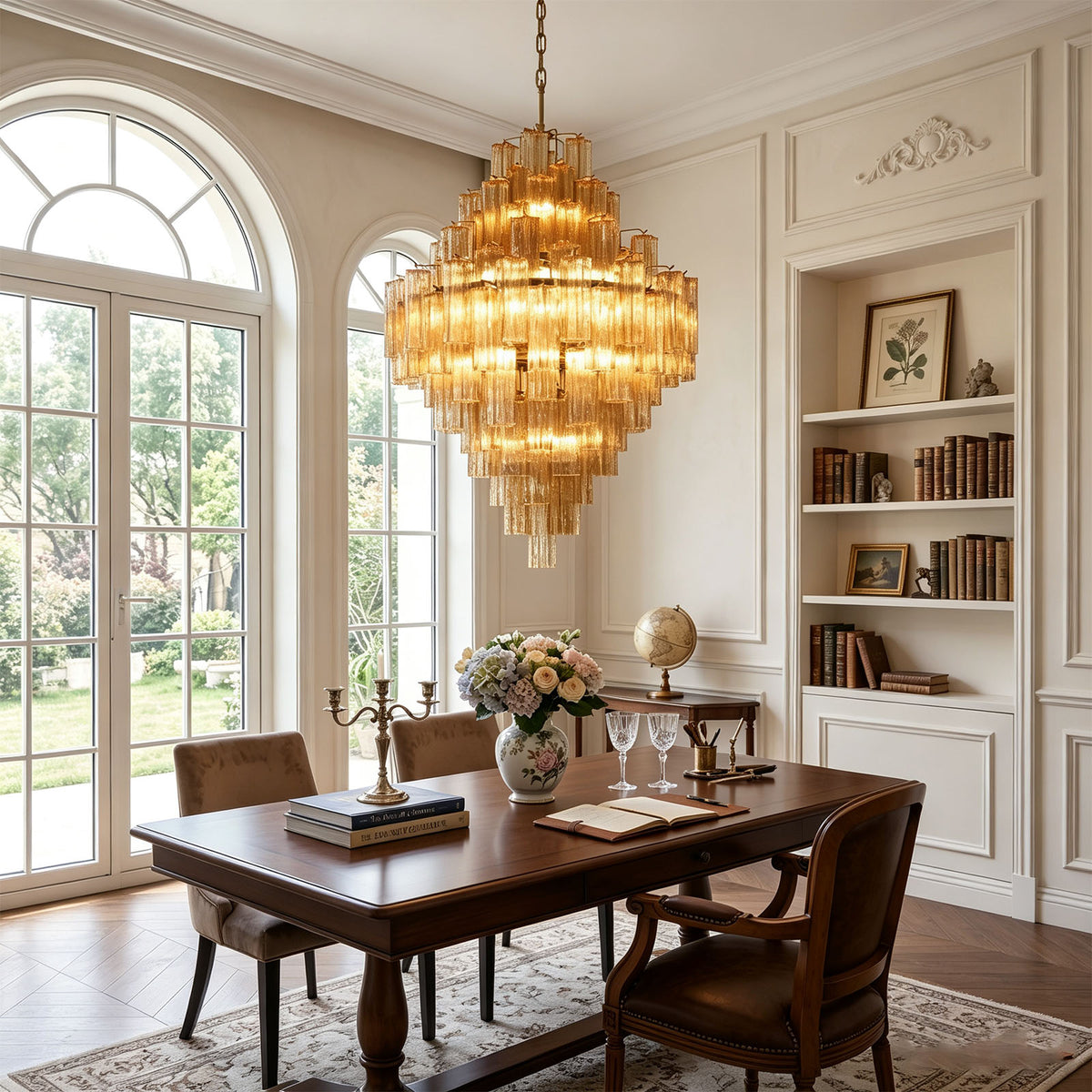 Kester Amber Glass Tier Chandelier | Amber Glass and Brass | Displayed over a wooden dining table in a room with arched windows | Severn Lighting