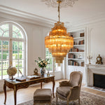 Kester Amber Glass Tier Chandelier | Amber Glass and Brass | Styled in a home office study above a wooden desk near a fireplace | Severn Lighting