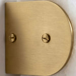 Lamelune Stacked Sconce | Solid Brushed Brass | Close-up of arched brass end cap with dual slotted screws | Severn Lighting