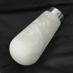 Larmelle Teardrop Sconce | Solid Alabaster | Single unlit teardrop stone shade on dark background | Severn Lighting