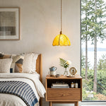 Liora Mosaic Glass Pendant Light | Yellow Mosaic Glass and Brass | Single yellow pendant hanging over a wooden nightstand in a cozy bedroom with scenic window views | Severn Lighting