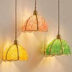 Liora Mosaic Glass Pendant Light | Colored Mosaic Glass and Brass | Three illuminated pendants in yellow, pink, and green hanging together against a dark studio background | Severn Lighting