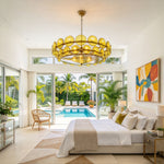 Lovenne Textured Glass Disc Ring Chandelier | Textured Glass and Brass | Lighting a luxury master bedroom suite featuring sliding doors to a pool terrace | Severn Lighting