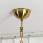 Lovenne Textured Glass Disc Ring Chandelier | Textured Glass and Brass | Close-up detail of the brass ceiling canopy and hanging chain assembly | Severn Lighting