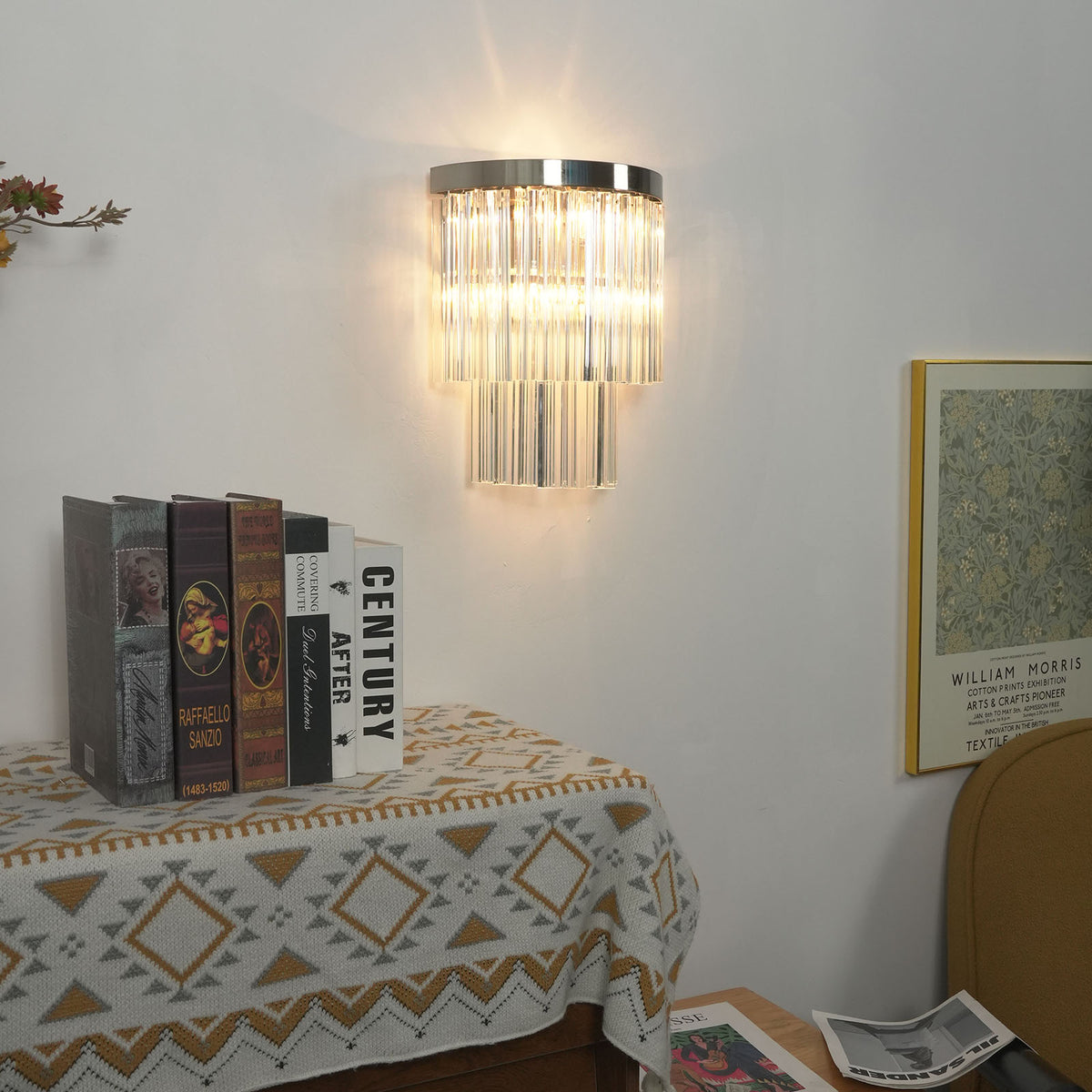 Marelle Glass Rod Tiered Wall Lamp | Clear Glass Rods and Metal | Real-life view mounted on a wall above a table with tablecloth | Severn Lighting