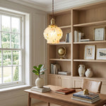 Marlowe Speckled Glass Pendant Lamp | Colorful Speckled Glass and Brass | Hanging above a wooden desk in a cozy home office study room with built-in wooden bookshelves | Severn Lighting