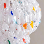 Marlowe Speckled Glass Pendant Lamp | Colorful Speckled Glass and Brass | Extreme macro texture shot focusing on the colorful glass specks and organic bubble details | Severn Lighting