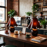 Mouchelle Mushroom Lamp | Red Glass and Brass | Pair of illuminated lamps on a modern coffee bar counter | Severn Lighting