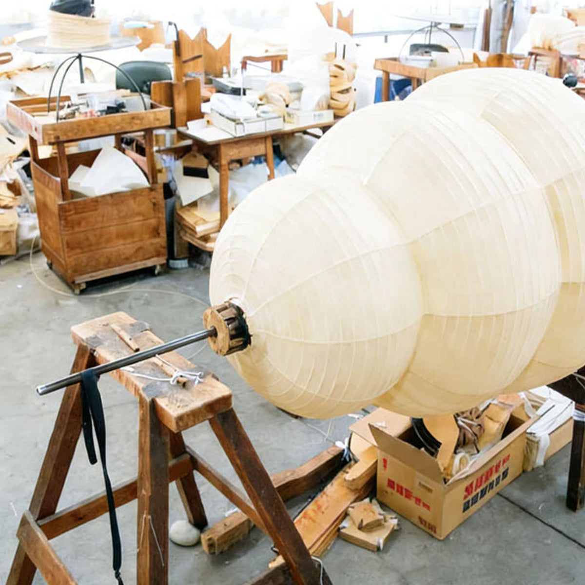 Nerine Tiered Washi Paper Table Lamp | Washi Paper and Metal | Behind-the-scenes look at the paper lantern crafting process in a workshop | Severn Lighting