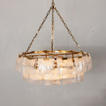 Nyle Tiered Glass Ring Chandelier | Textured Glass and Brass | Full product view hanging gracefully against a neutral backdrop | Severn Lighting