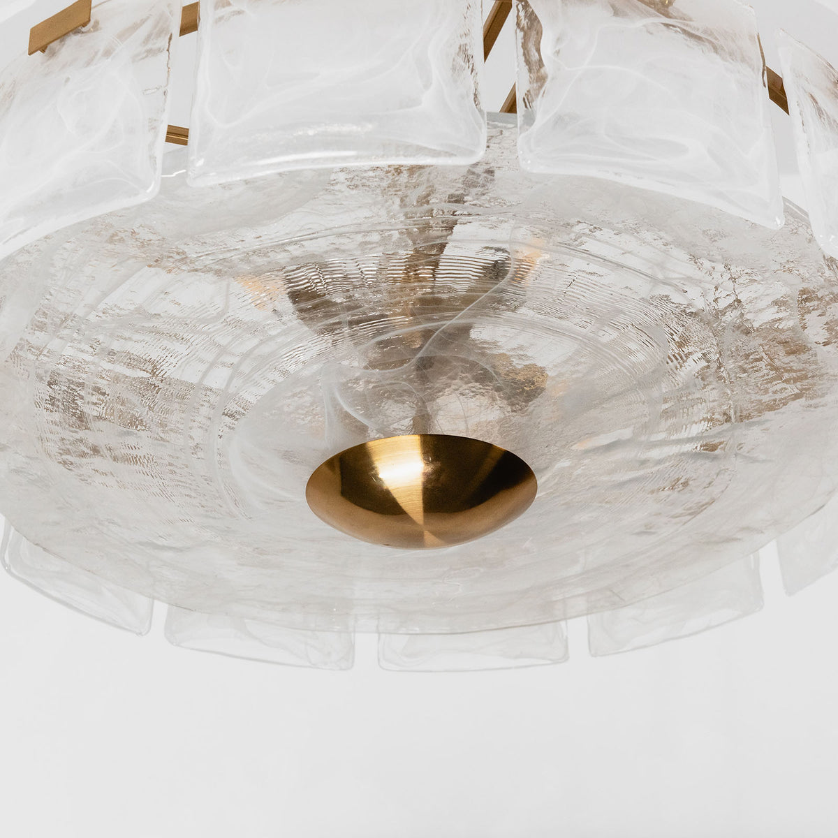 Nyle Tiered Glass Ring Chandelier | Textured Glass and Brass | Bottom perspective view of the frosted glass diffuser dish and finial | Severn Lighting