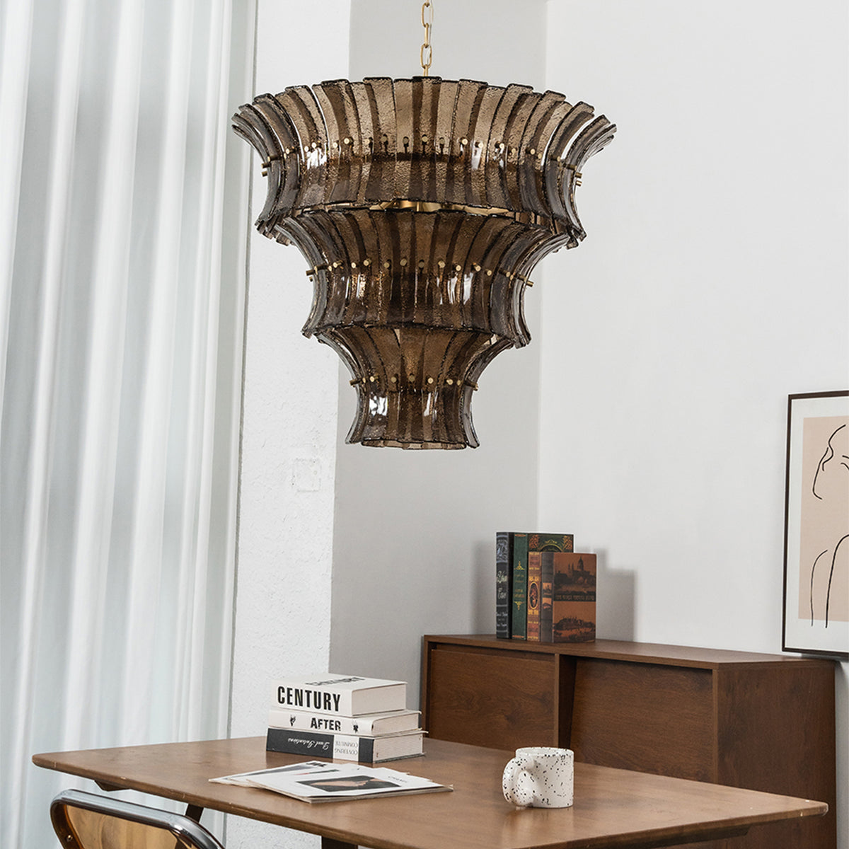 Octavia Sculptural Smoked Glass Chandelier | Textured Smoked Glass | Casting a warm ambient glow over a dark wood dining table and matching chairs near a window | Severn Lighting