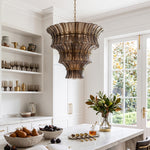 Octavia Sculptural Smoked Glass Chandelier | Textured Smoked Glass | Hanging in a bright minimalist dining space with open shelves and a fruit bowl on the table | Severn Lighting