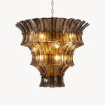 Octavia Sculptural Smoked Glass Chandelier | Textured Smoked Glass | Full front view of the multi-tiered luxury fixture glowing against a plain background | Severn Lighting