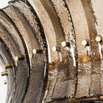 Octavia Sculptural Smoked Glass Chandelier | Textured Smoked Glass | Extreme close-up shot showing the curved textured glass panels held by small metal hardware | Severn Lighting