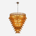 Odile Amber Petal Tier Chandelier | Amber Glass and Metal | Front full view on a pure white background, illuminated | Severn Lighting