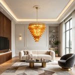 Odile Amber Petal Tier Chandelier | Amber Glass and Metal | Displayed in a luxury living room featuring a white sofa and tray ceiling | Severn Lighting