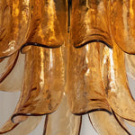 Odile Amber Petal Tier Chandelier | Amber Glass and Metal | Detail shot highlighting the curved tips of the amber glass petals | Severn Lighting