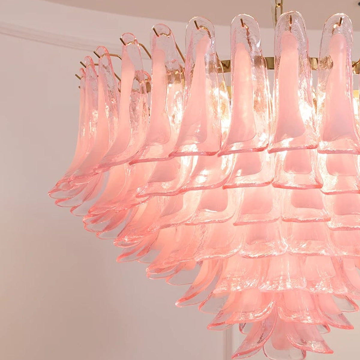 Ombeline Tiered Pink Glass Chandelier | Pink Glass and Brass | Angled view showing the layered cascading pink glass tiers | Severn Lighting