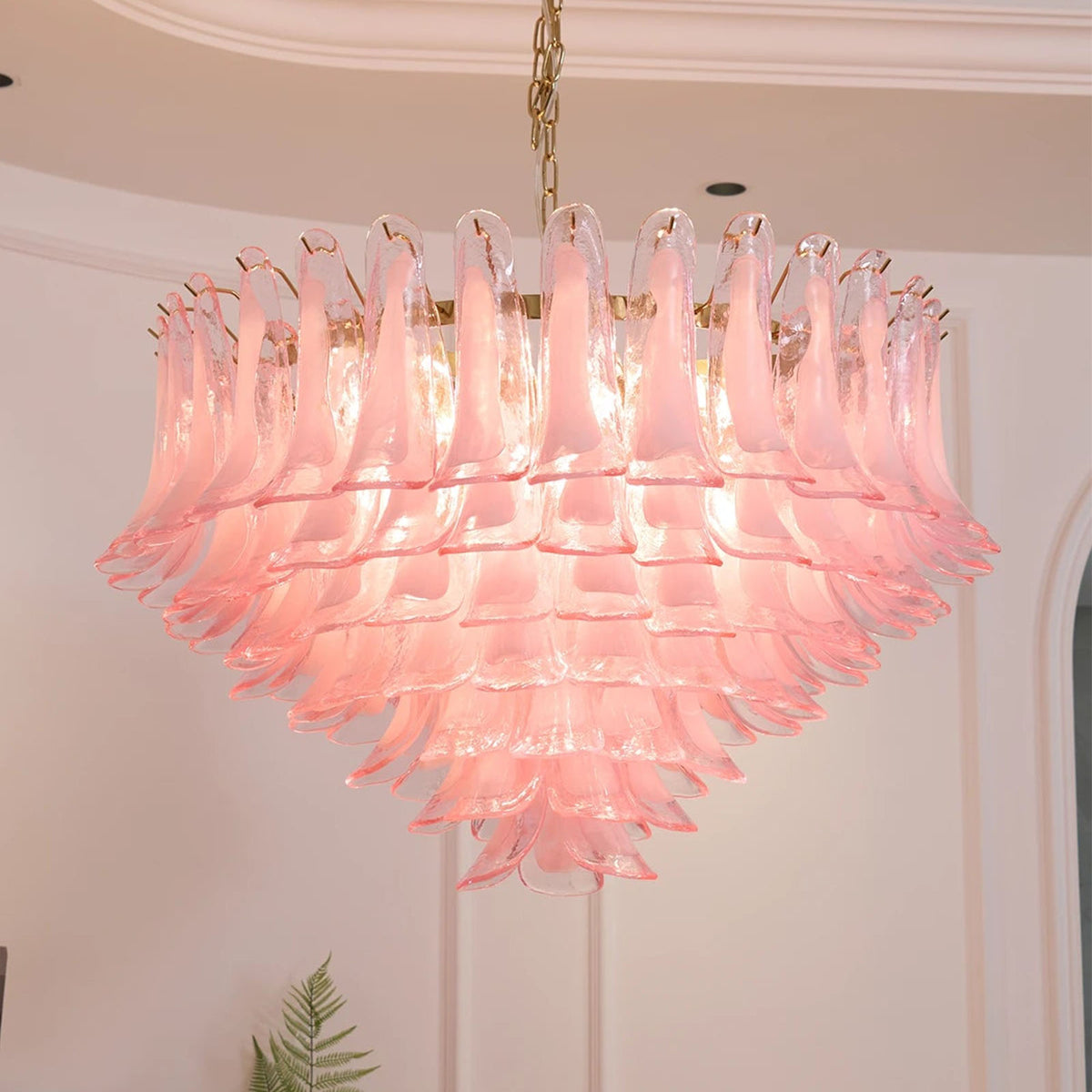 Ombeline Tiered Pink Glass Chandelier | Pink Glass and Brass | Bottom-up perspective of the illuminated chandelier against a ceiling | Severn Lighting